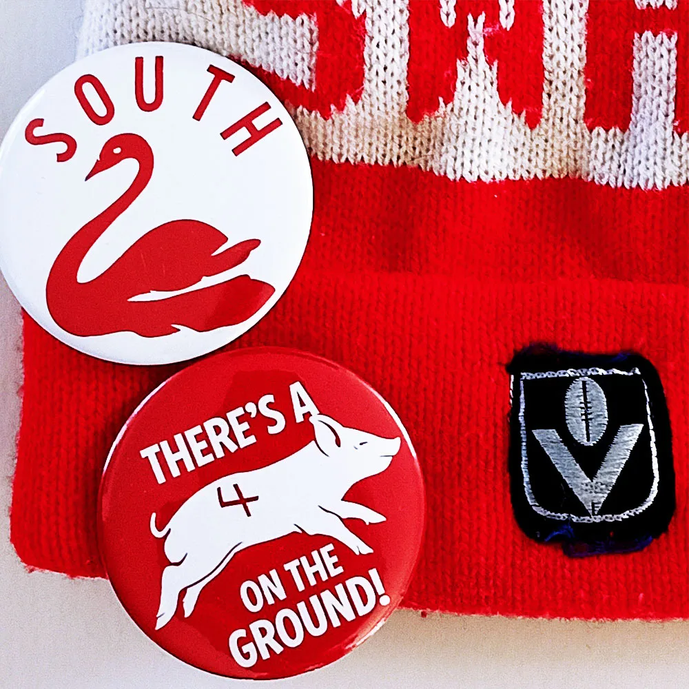 swans beanie badges